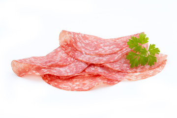 Salami smoked sausage slices isolated on white background cutout.