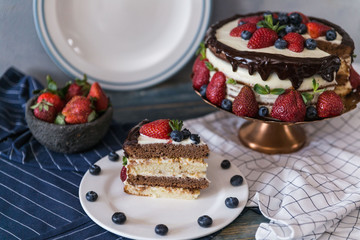 Homemade sour cream cake decorated with berries