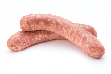 Raw sausage with parsley leaf isolated on white background.