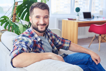 Fototapeta premium Nice mister relaxing on fashionable sofa