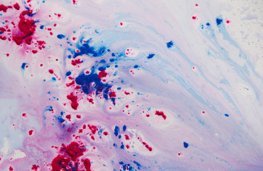 Red and blue paint in water