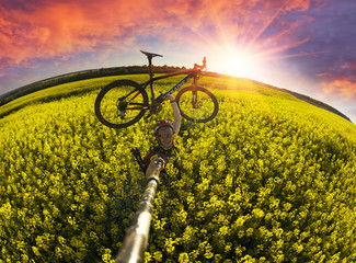 Fototapeta na wymiar Athlete cyclist on a golden field