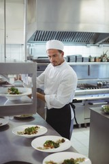 Chef looking at an order list in the commercial kitchen