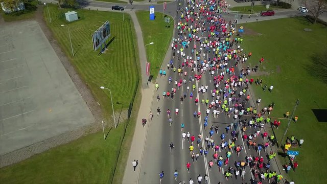 Aerial View of Lattelecom Marathon 2017, Runners run at the Riga International Marathon on May 14, 2017, Riga, Latvia, People run down the Streets between Daugava RIver and Park