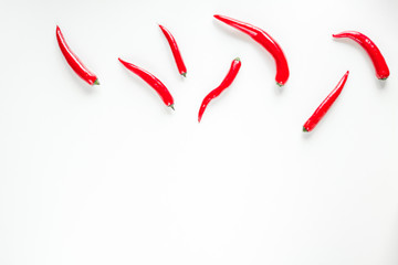 red food with chili pepper on white background top view space for text