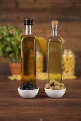 Dry pasta with ingredients on a old wood