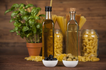 Fototapeta na wymiar Dry pasta with ingredients on a old wood