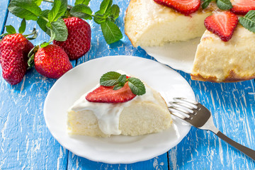 Cottage cheese casserole with coconut, decorated with strawberries and mint