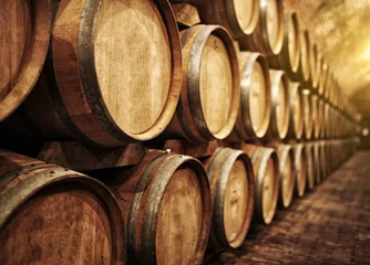 Tuinposter Wine barrels in wine-vaults in order © Zsolt Biczó