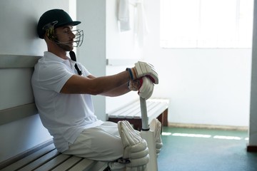 Close up of cricket player sitting on bench