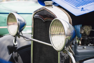 Headlights of an old car with a shallow depth of field