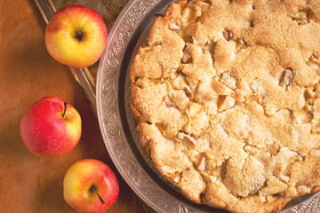 Sweet apple pie on the table, top view