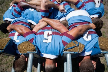 Overhead view of rugby players making huddle