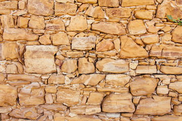 Beige Steinmauer Hintergrund