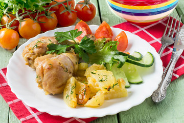 Chicken drumsticks, baked with potatoes