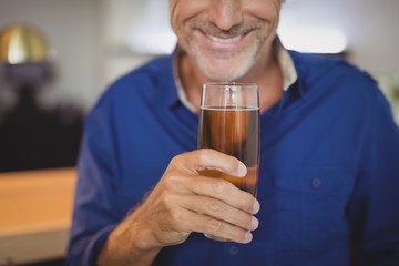 Mature man having a glass of beer