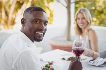 Couple toasting their wine glasses
