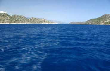 A quiet bay on the background of mountains and sea.View of the Mediterranean Sea and the mountains, Turkey/Beautiful water of Mediterranean Sea off the Turkish coast