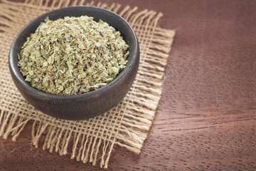 Dried leaves of oregano in the bowl