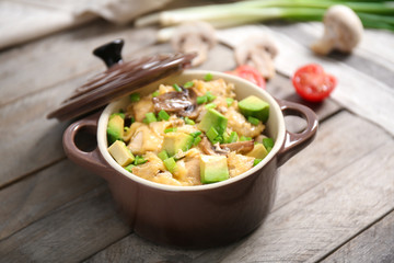 Delicious chicken casserole meal in saucepan on table