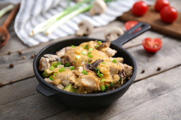 Delicious chicken casserole meal in pan on table