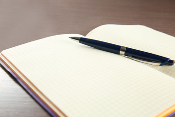 Empty notebook with pen on table. Job interview concept