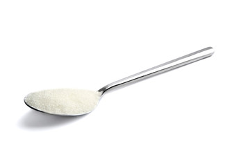 Sugar in spoon on white background