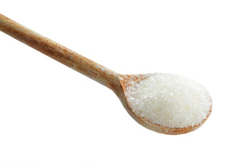 Sugar in spoon on white background