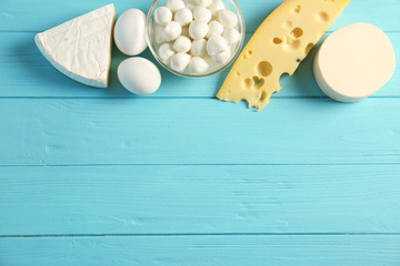 Dairy products on wooden table, top view