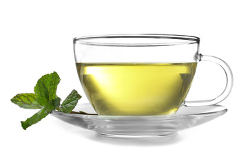 Cup of tea with mint leaves on white background