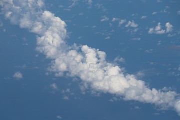 Clouds above on blue  sky background
