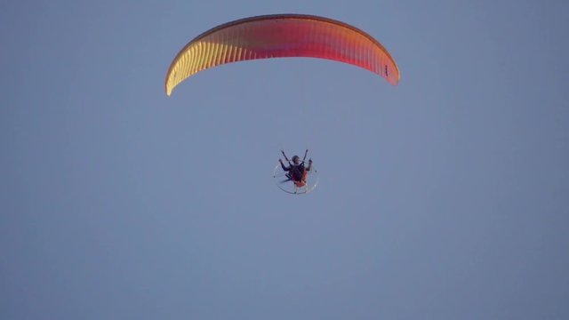 Paraglider flies on the motor paraplan