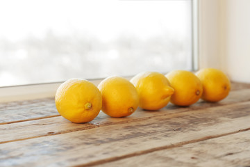 Ripe lemons on windowsill