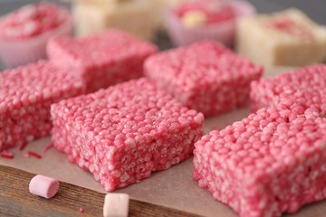 Pink crispy dessert on wooden background