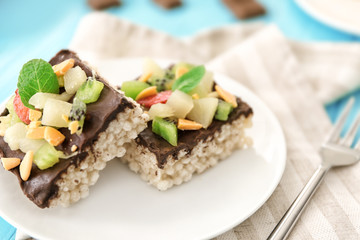 Delicious crispy dessert with chocolate and fruits on plate