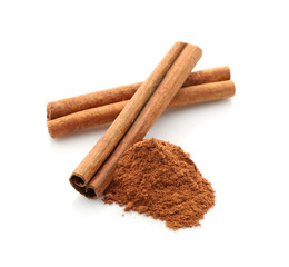 Cinnamon sticks and powder isolated on white, closeup