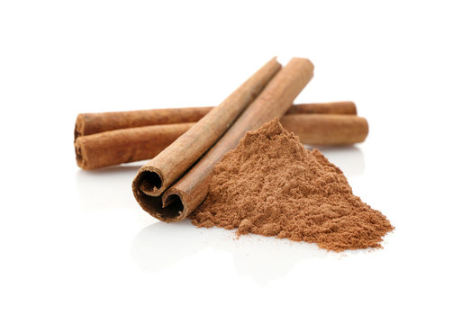 Cinnamon sticks and powder isolated on white