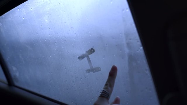 Teen Girl Writes "I Heart U!" On Car Window, Cars Pass By In Background