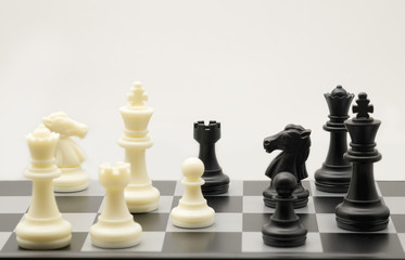 black and white chess figure on table with copy space for strategy business; chicanery; slyness; survival; foeman; fighting; planing concept.