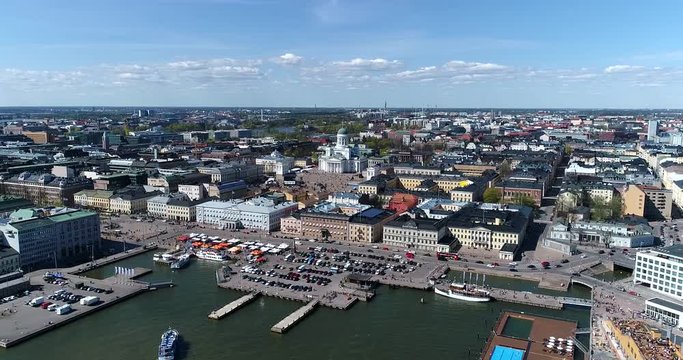 Helsinki harbor, Cinema 4k aerial view of kauppatori market square and the downtown, on a sunny summer day, in Helsinki, Finland