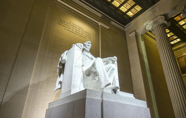 The statue of Abraham Lincoln sitting in a chair at Lincoln Memorial in Washington