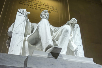 The statue of Abraham Lincoln sitting in a chair at Lincoln Memorial in Washington