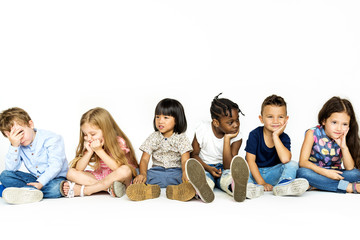 Group of kids studio shoot and sitting together