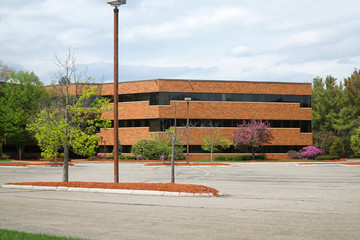 Obraz premium company buildings and empty parking lot