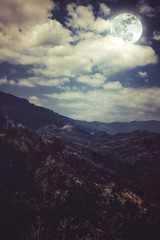 Beautiful landscape of blue dark night sky and cloudy above mountain peak.