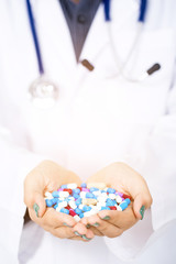 doctor holding colorful medical drug