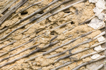 old weathered wall made of wood and clay background