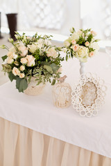 Wedding ceremony decoration in the restaurant. Decoration of wedding table with tender white textile