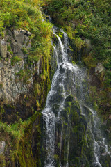 Fototapeta na wymiar Waterfall in the Russkaya Bay at southwestern part of Avacha Gulf of Pacific ocean