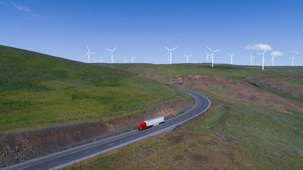 Windy road with semi-truck and trailer driving